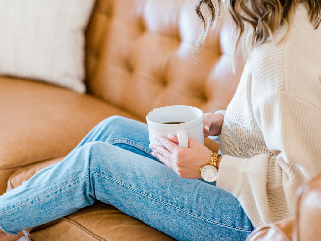 How to Build Brand Loyalty Without a Loyalty App - Woman on Couch with Coffee She Loves