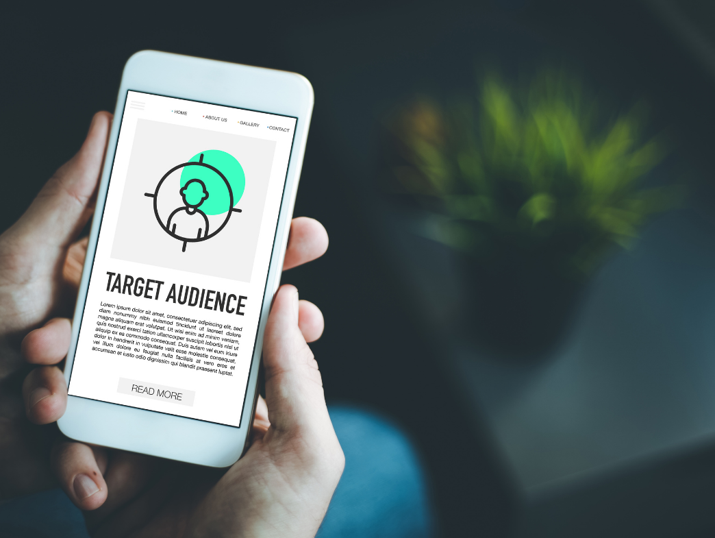 How to Define Your Target Audience - Person using iphone with target audience